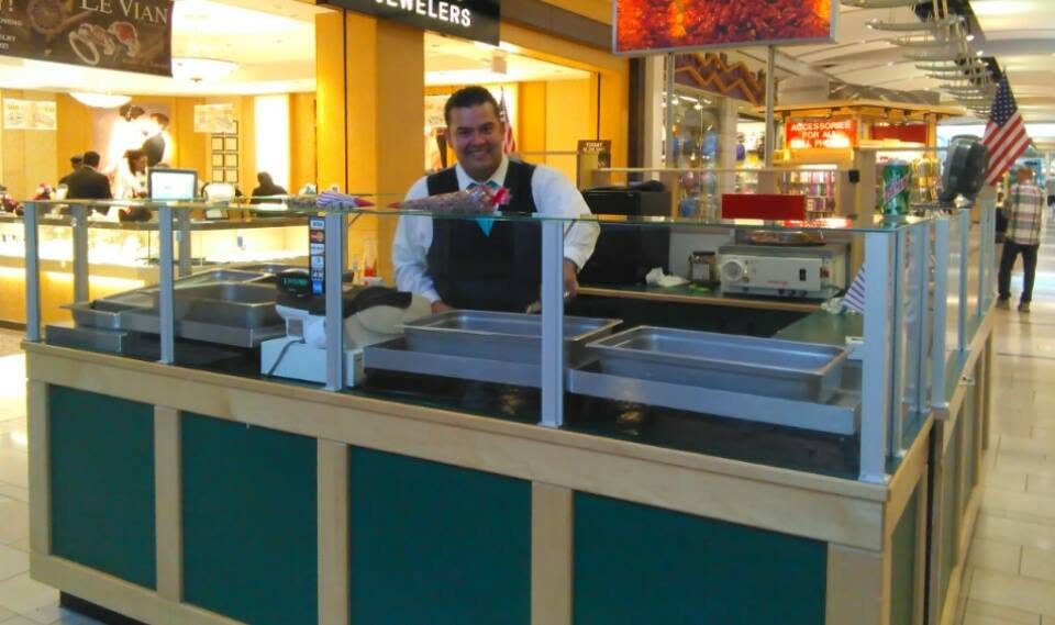 Mario, owner of California's Delicious Nuts, at the mall